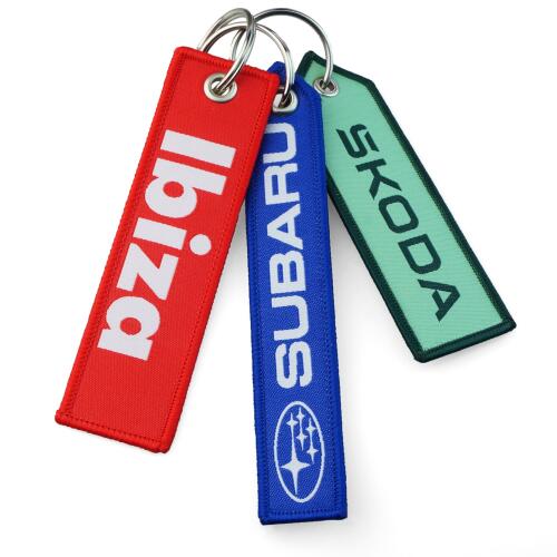 reklamni-moderni-originalni-zakazkove-textilni-privesky-remove-before-fly-firemni-darek-nazev-firmy-logo-auto.jpg